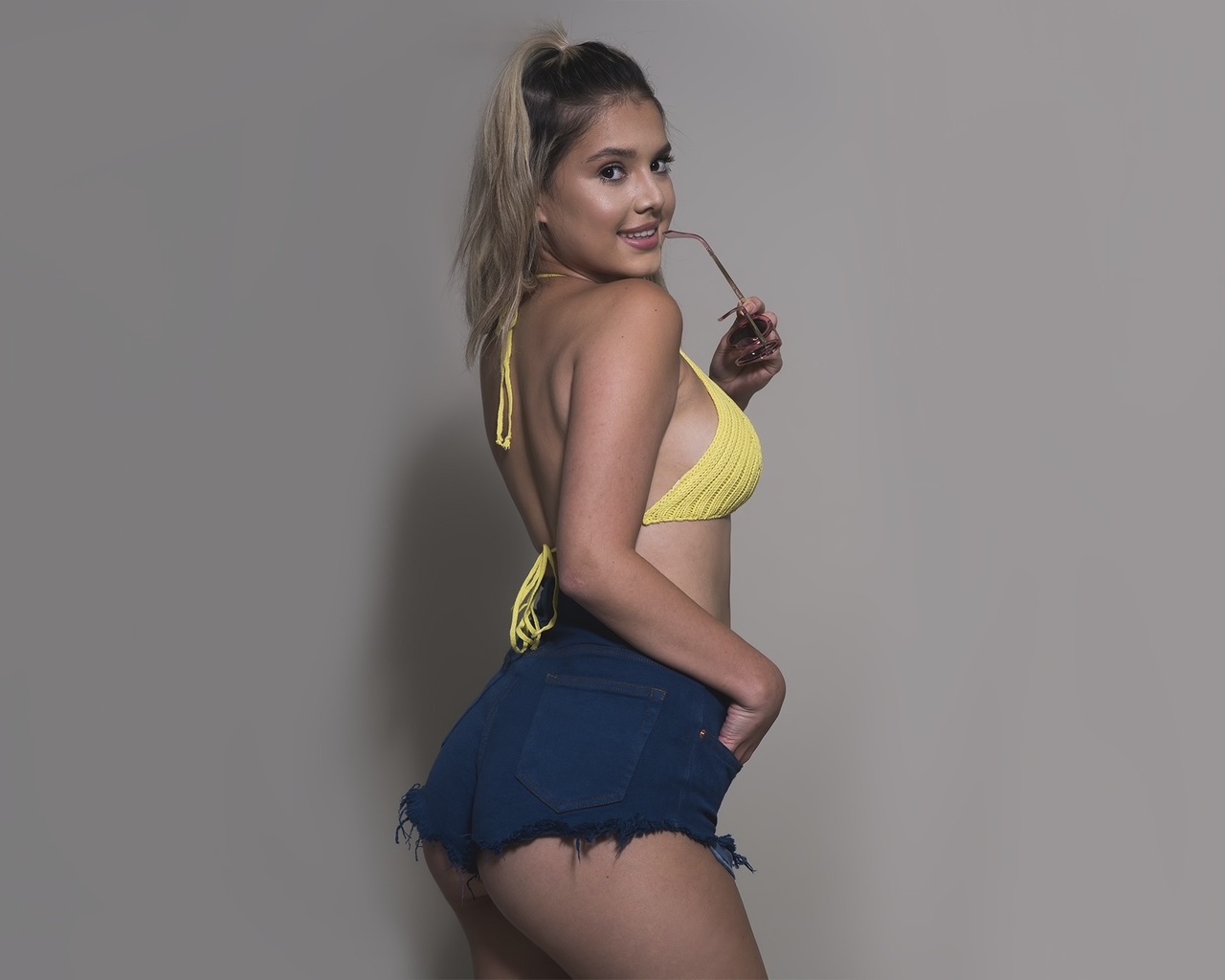 model, simple background, long hair, ass, photography, dress, smiling, jean shorts, black hair, fashion, hair, lingerie, bikini top, swimwear, clothing, supermodel, girl, beauty, hand, leg, muscle, blond, hairstyle, photo shoot, brown hair, art model, abd