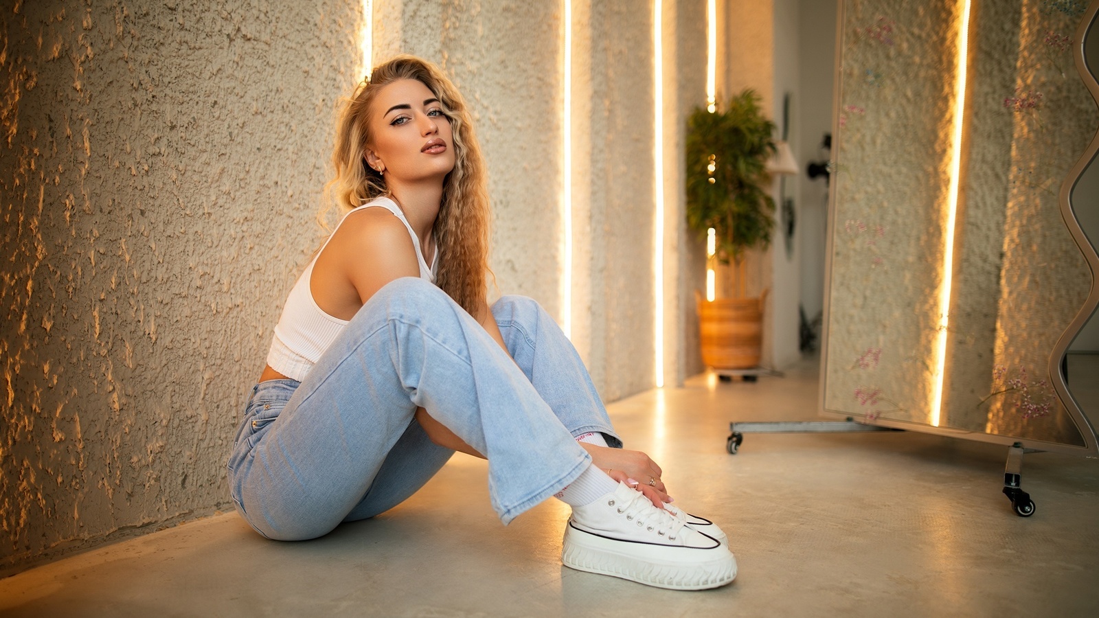 dmitry shulgin, women indoors, jeans, on the floor, blonde, , model, sitting, long hair, studio, tank top, white tank top, white tops, red lipstick, short tops