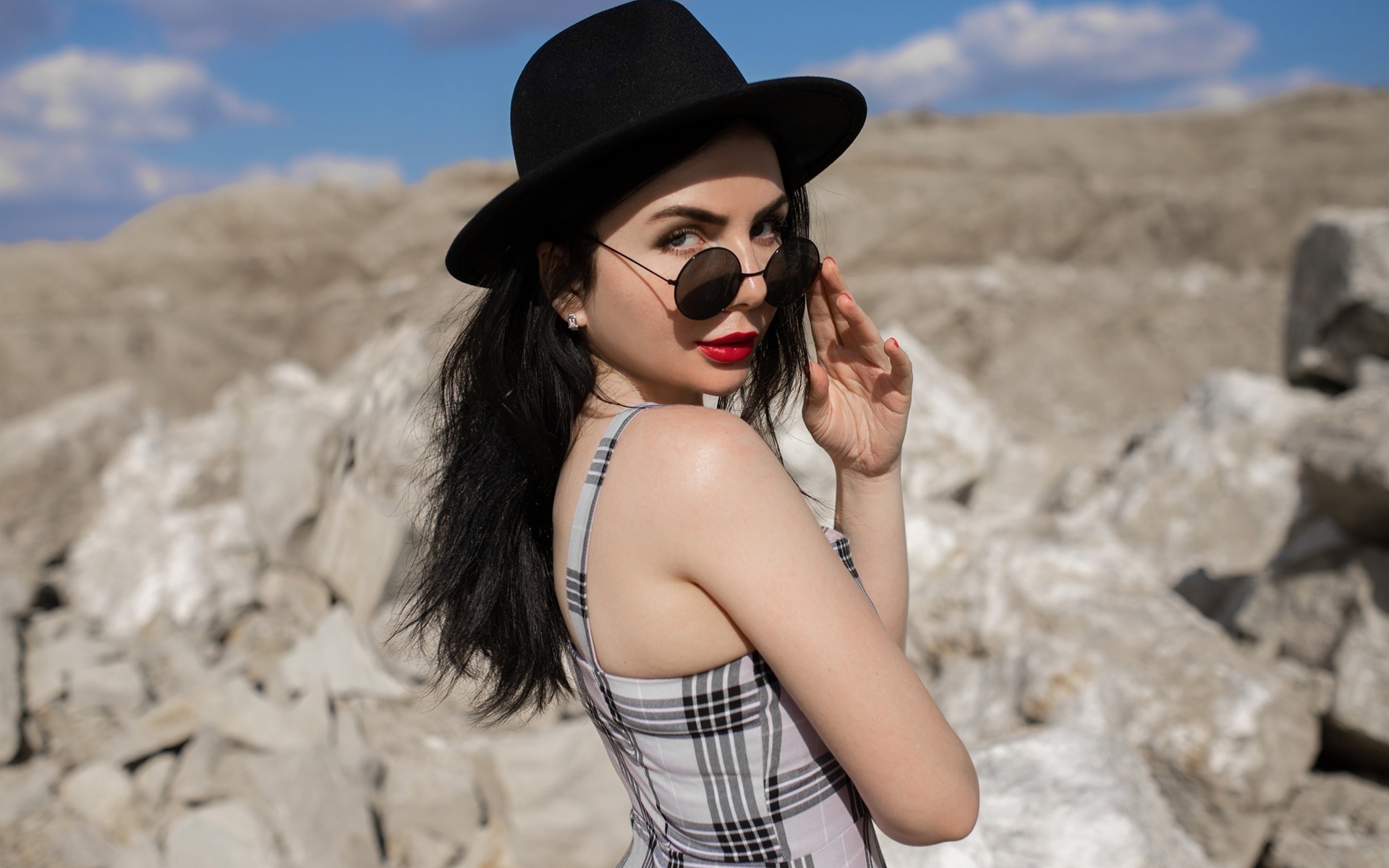 red lipstick, brunette, , women outdoors, sky, clouds, women with glasses, model, women with shades, rocks, dress, black hat