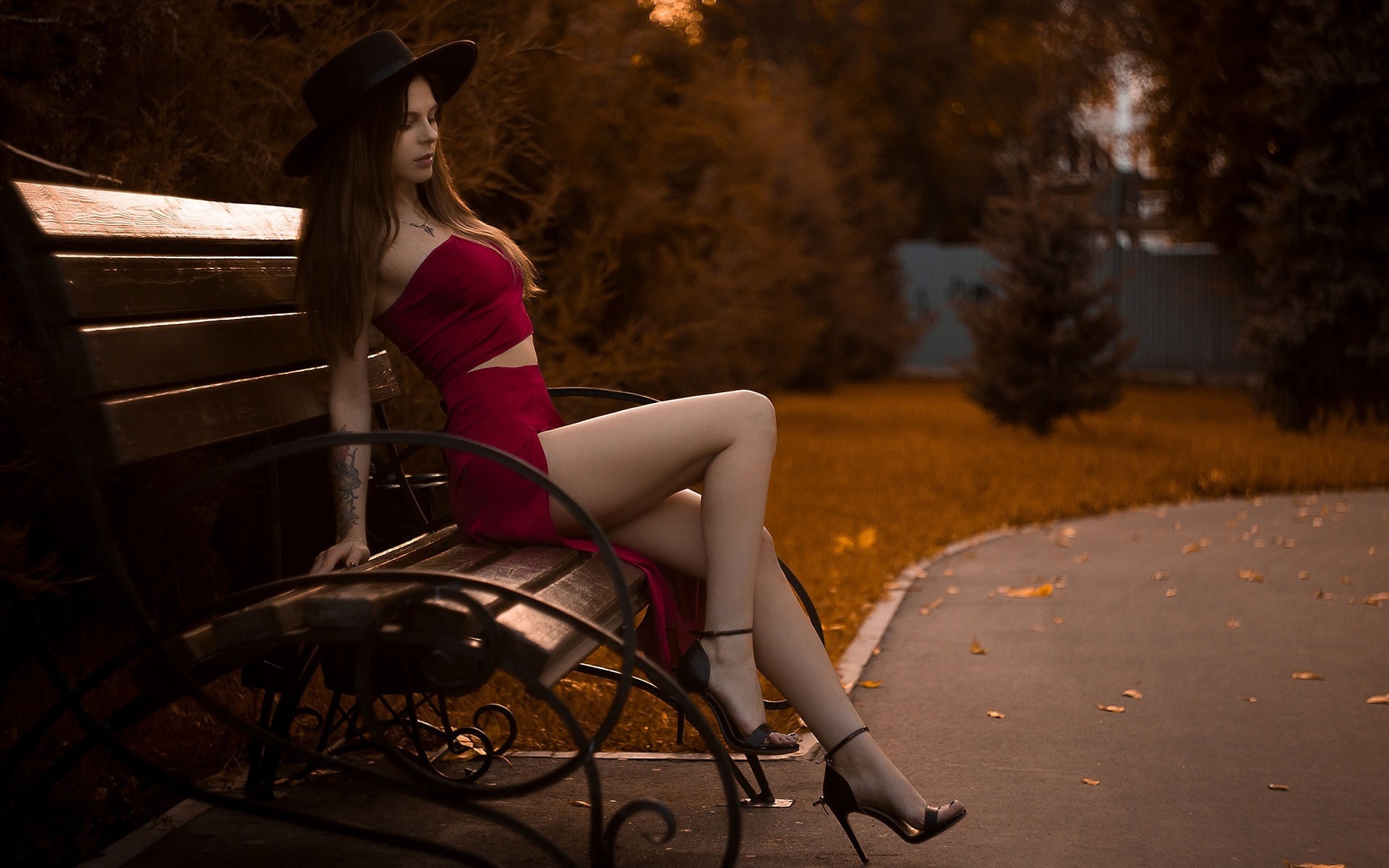 maks miron, red skirt, park, brunette, , red tops, women outdoors, bench, tattoo, model, trees, sitting, legs, black hat, grass