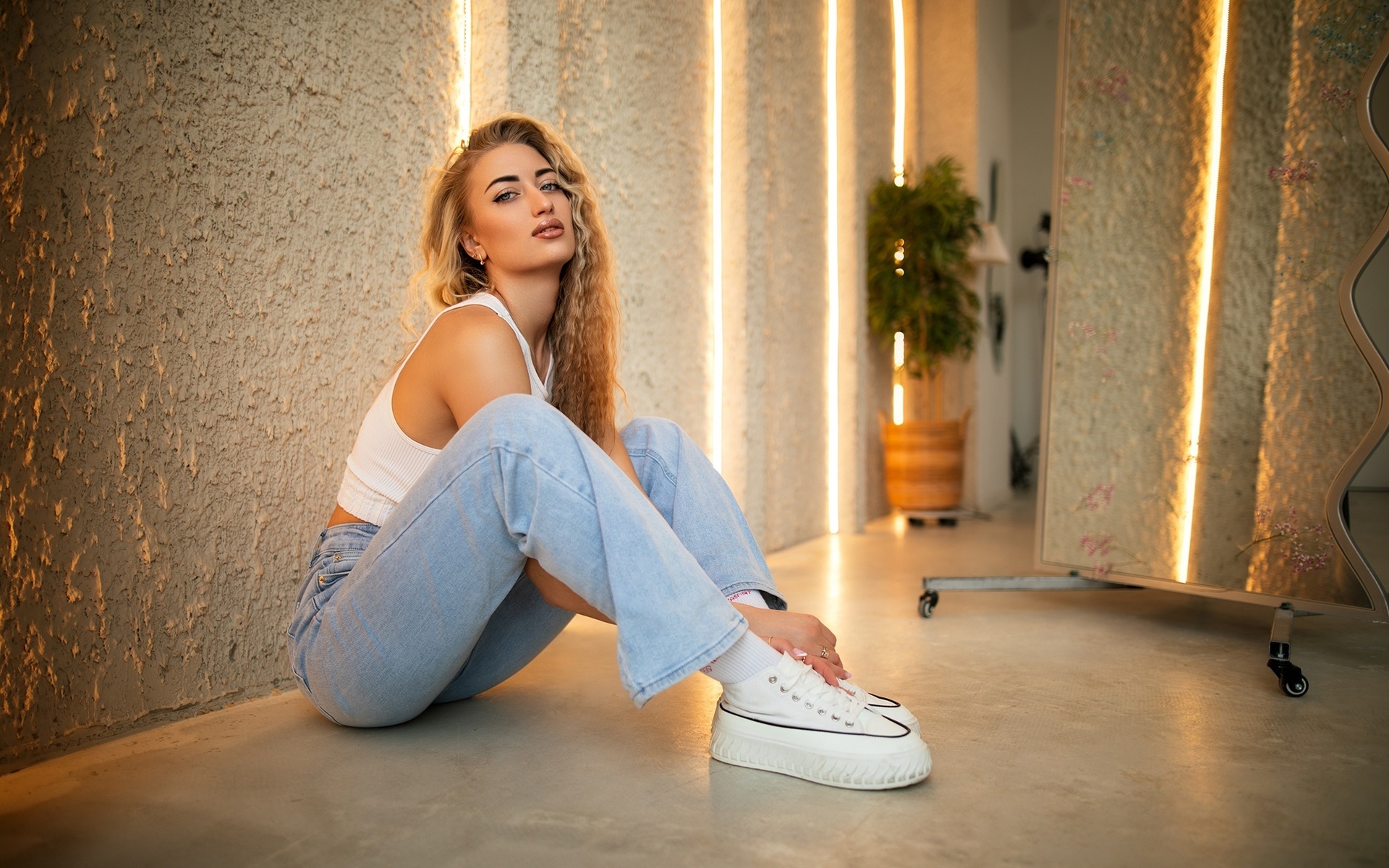 dmitry shulgin, women indoors, jeans, on the floor, blonde, , model, sitting, long hair, studio, tank top, white tank top, white tops, red lipstick, short tops