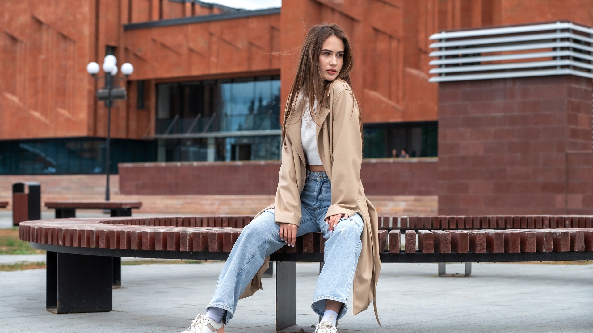 jeans, white tops, brunette, sitting, public, , women outdoors, model, sneakers, urban, trench coat