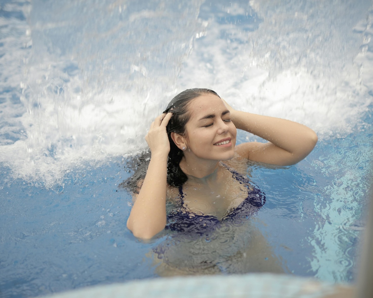 woman, in blue bikini, top, in water