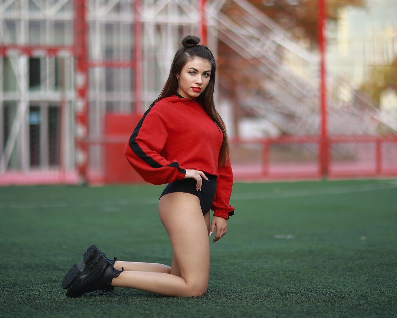 synthetic grass, brunette, women outdoors, sportswear, model, , ass, sneakers, kneeling, red lipstick