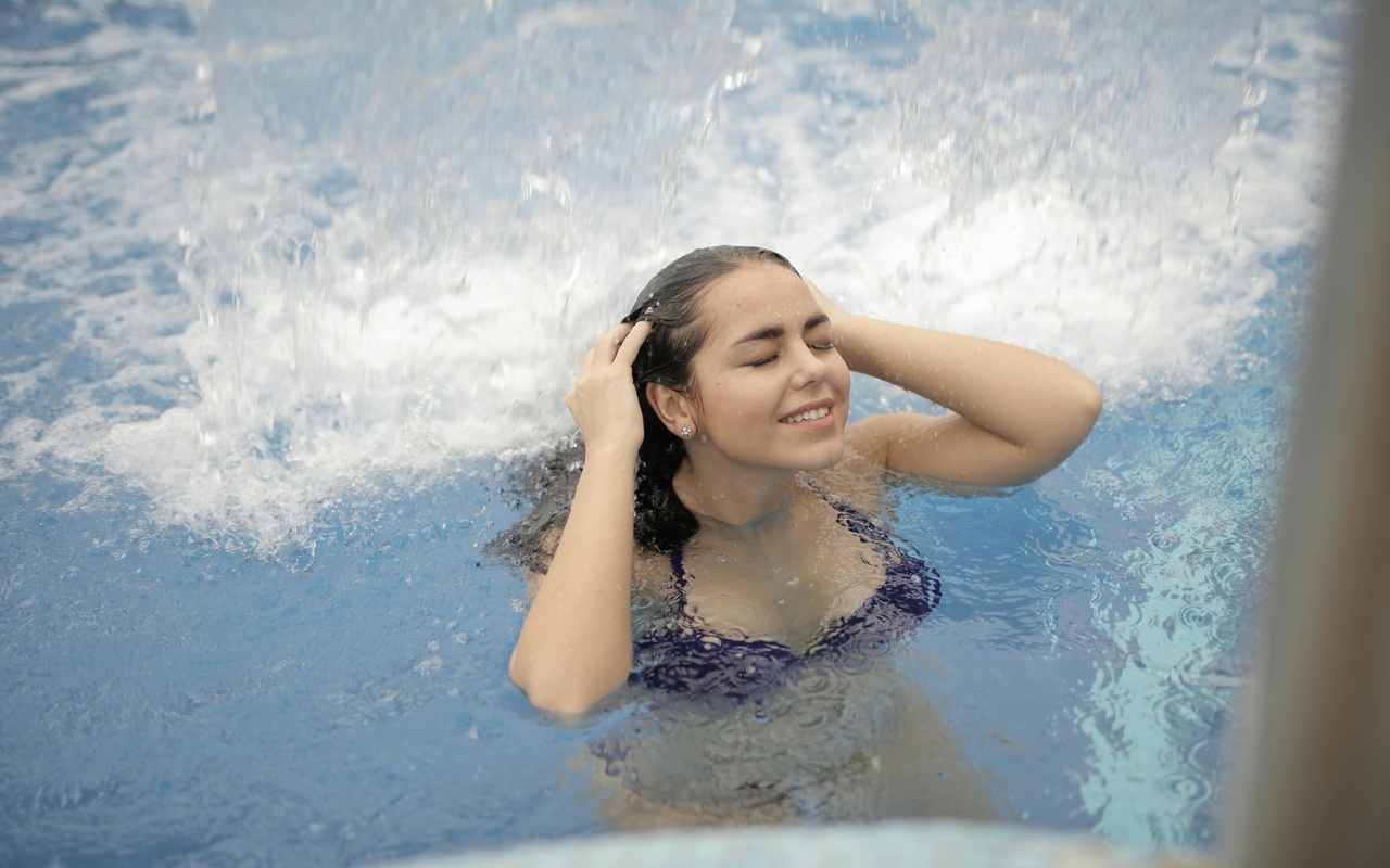 woman, in blue bikini, top, in water