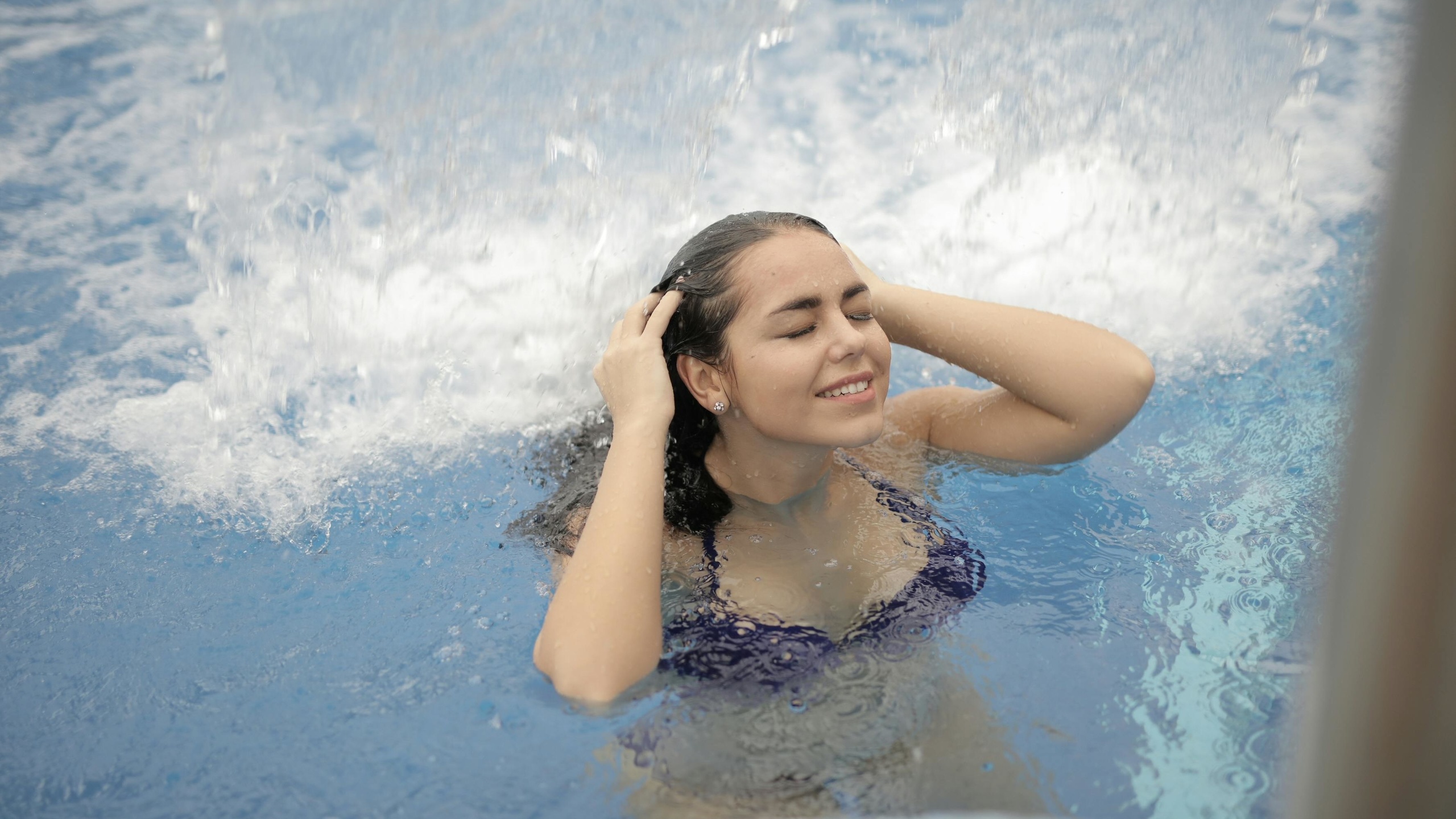 woman, in blue bikini, top, in water