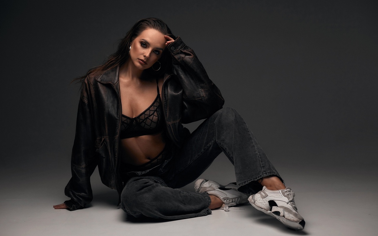 alexander skripnikov, women indoors, brunette, studio, black lingerie, , model, jeans, black bra, hips, jacket, belly button, open jeans, black panties, leather jacket, on the floor, sneakers