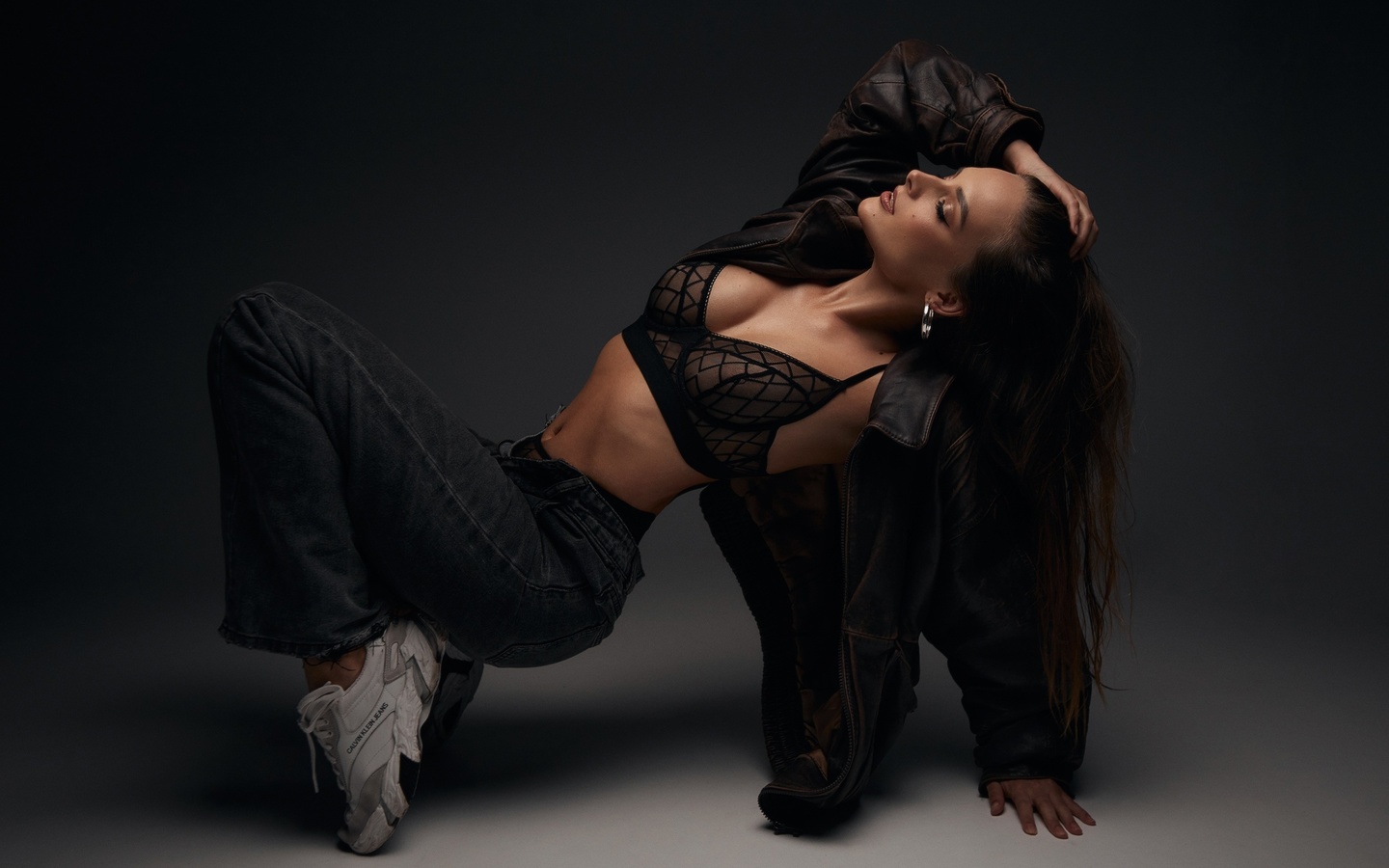 alexander skripnikov, women indoors, brunette, studio, black lingerie, , model, jeans, black bra, hips, jacket, belly button, open jeans, black panties, leather jacket, on the floor, sneakers