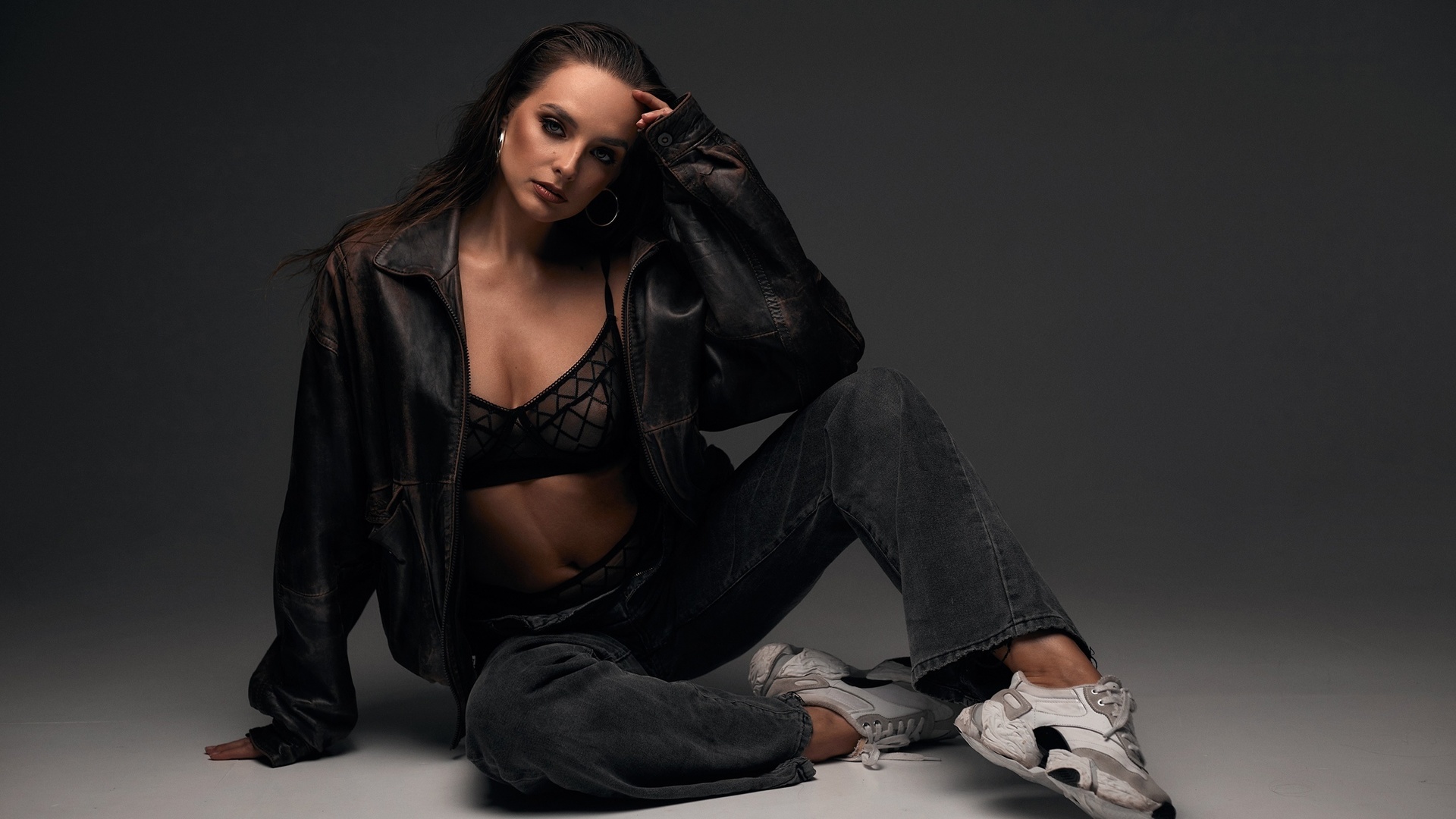 alexander skripnikov, women indoors, brunette, studio, black lingerie, , model, jeans, black bra, hips, jacket, belly button, open jeans, black panties, leather jacket, on the floor, sneakers