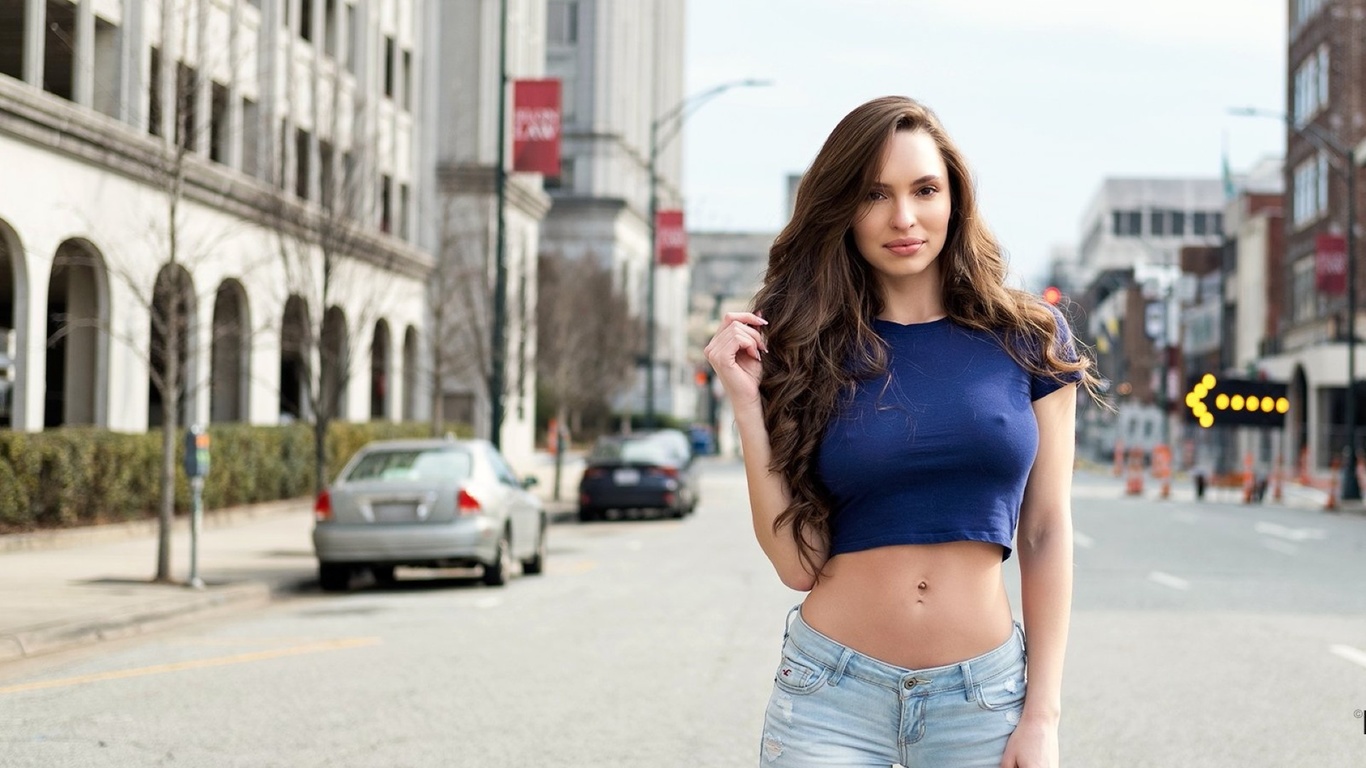 outdoors, babe, brunette, jeans, shirt, pose, cars, buildings