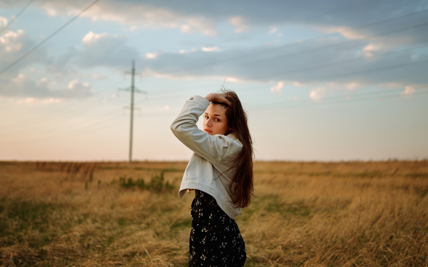 black dress, brunette, field, denim jacket, , grass, model, women outdoors, sky, clouds, long hair