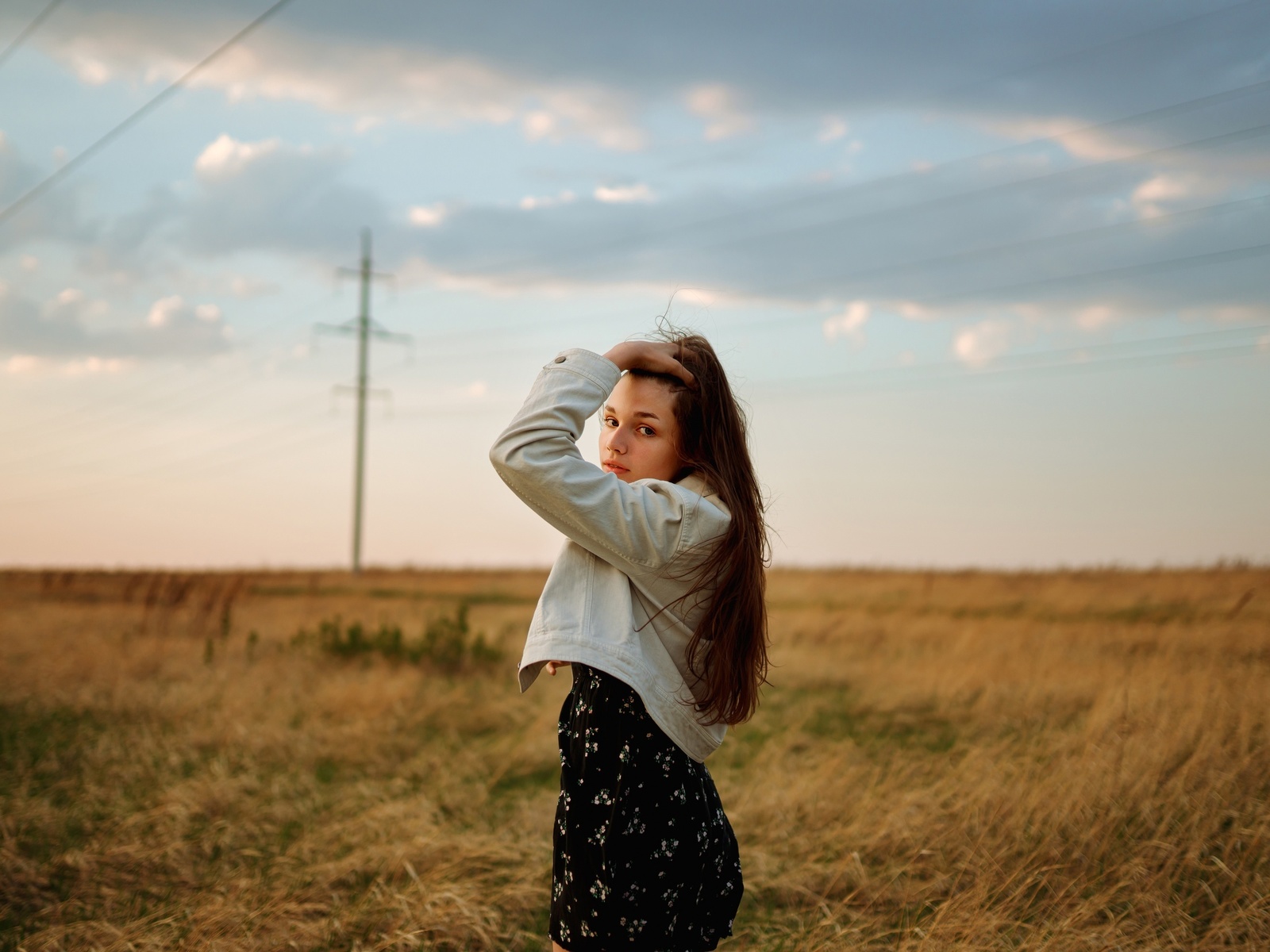 black dress, brunette, field, denim jacket, , grass, model, women outdoors, sky, clouds, long hair