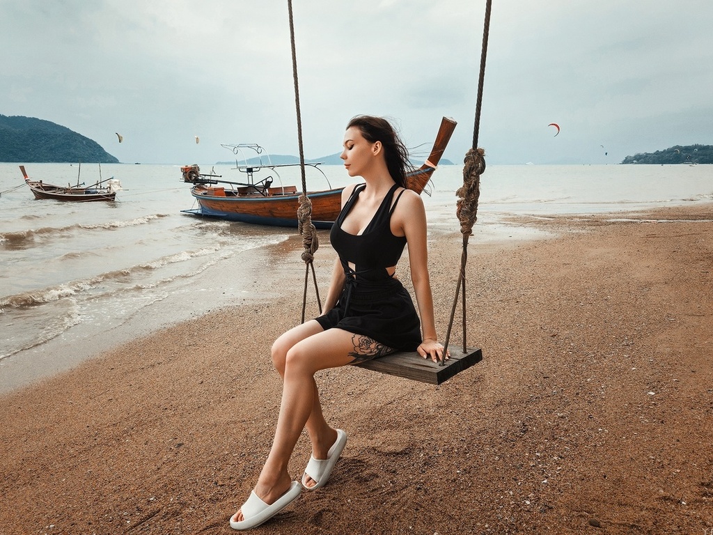 yaguar photography, sitting, swings, , model, women on beach, sky, brunette, tattoo, boat, women outdoors, clouds, minidress, black dress, women, flip flops, beach